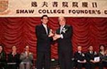 Prof. P.C. Ching (left), Head of College, presents a souvenir to Sir C.K. Chow, guest of honour