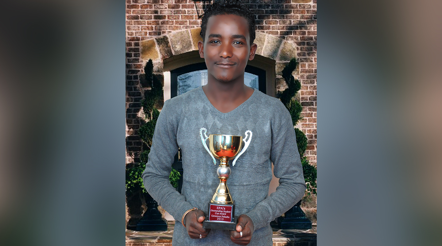 Gifted and talented, Ginenus received assorted prizes and awards in school, including the Outstanding Student Cup Award from the Ethiopian Pharmaceutical Association <em>(courtesy of interviewee)</em>
