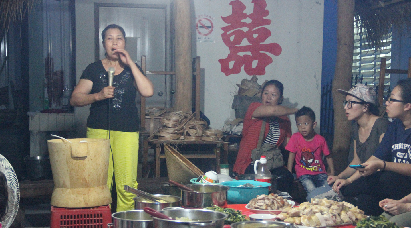 In the 2014 annual field trip, the staff and students of the department visited Doulan in Taitung, Taiwan. This photo was taken in a farewell party for the students with the host explaining about the traditional food and culinary practices of the Amis, an indigenous people of Taiwan <br /><em>(Source: The blog of the anthropology department, 5 December 2014)