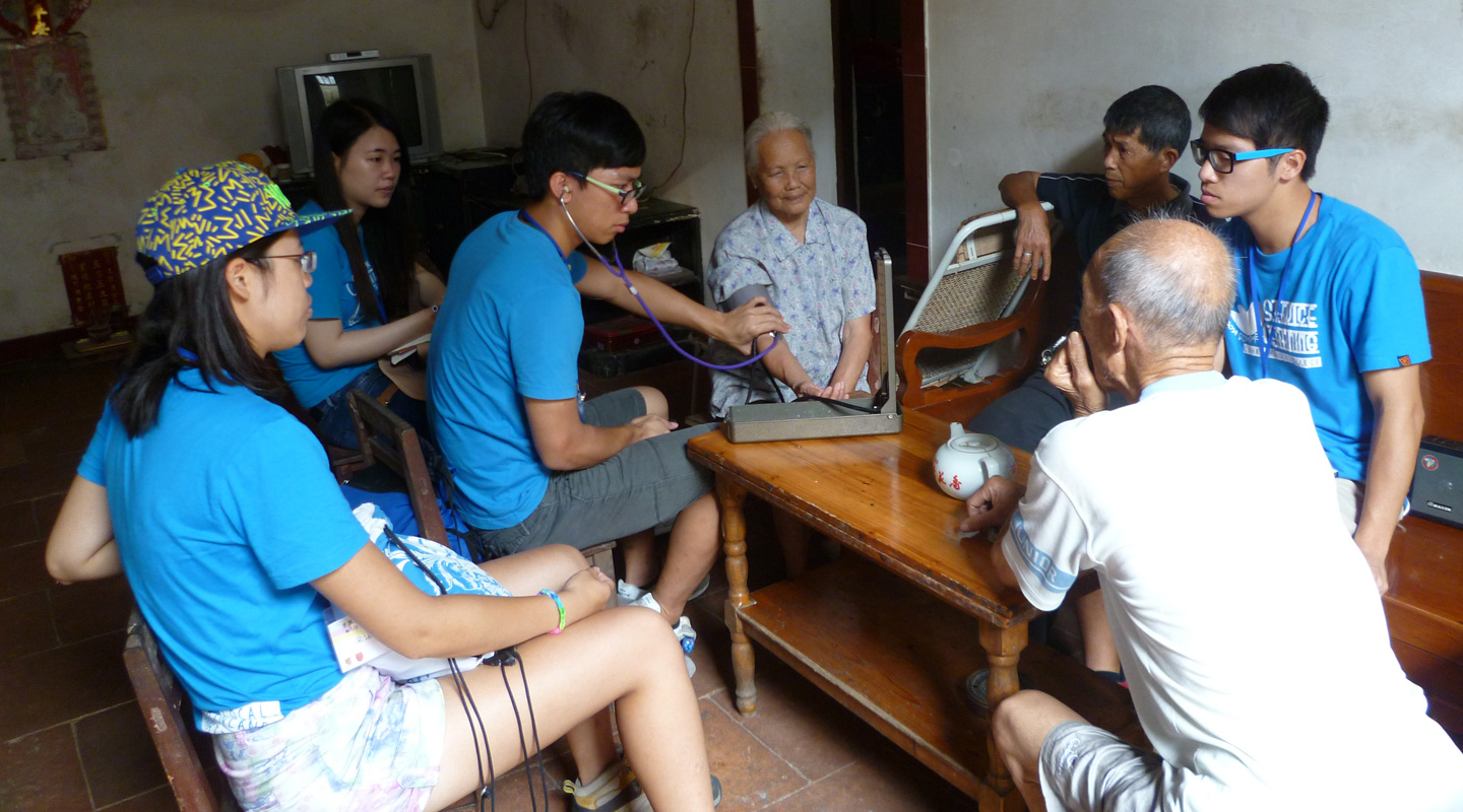 Students visit villagers in China to test their blood pressure and other vital statistics