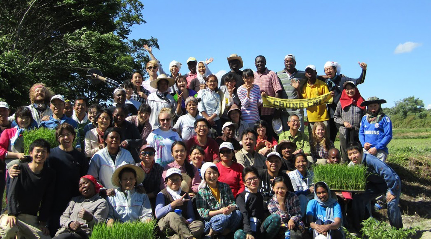 Students from around the world work on an experimental farm in Japan