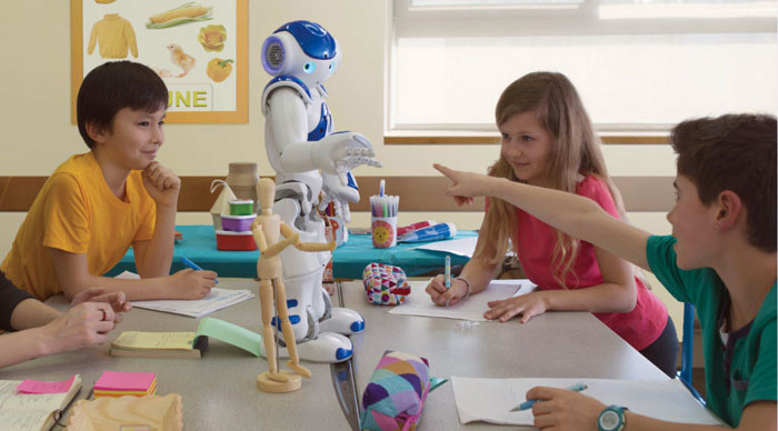 With the help of NAO, children are trained to recognize commonly used gestures, including certain markers and iconic gestures. <em>(Photo: Aldebaran)</em>