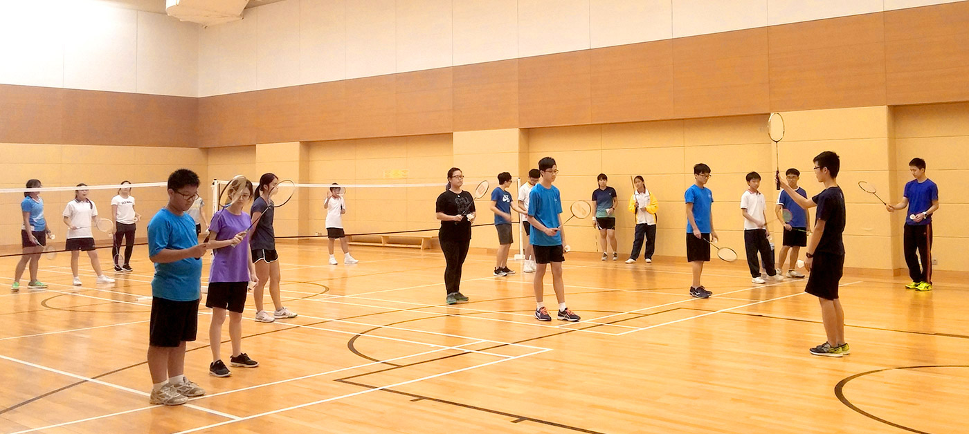 CUHK students partner with secondary school students to learn to play badminton