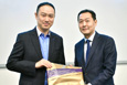 Mr. Tommy Cho (ISO) presents a souvenir to Mr. Alvis Ko