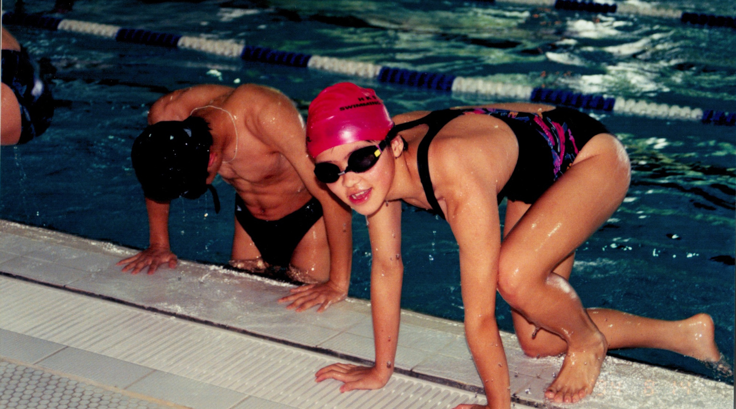 Sherry <em>(right)</em>, aged 11, at the national swimming team <em>(courtesy of interviewee)</em>