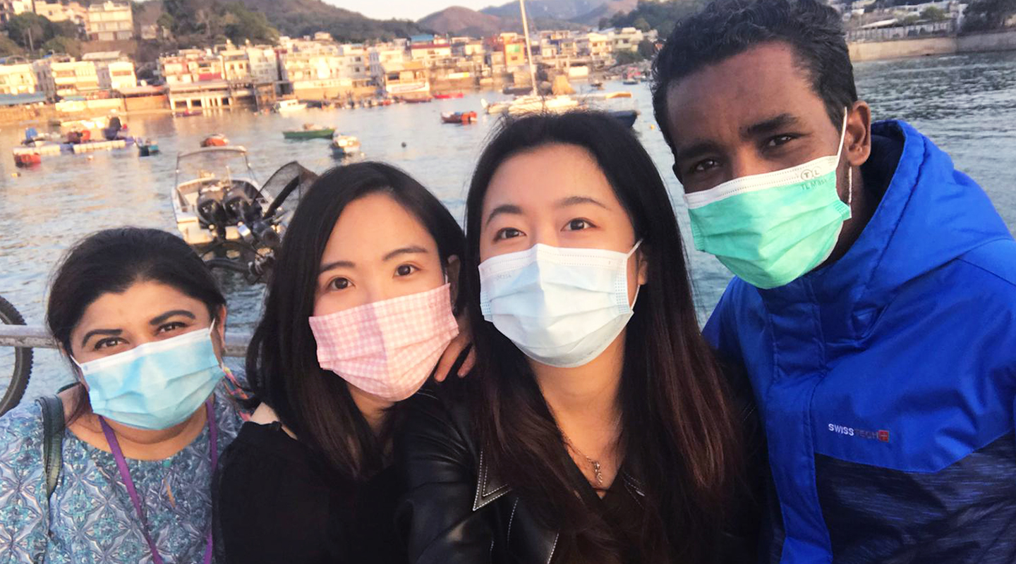 Ginenus <em>(rightmost)</em> spending quality time with CUHK staff members and friends on Lemma Island <em>(courtesy of interviewee)</em>
