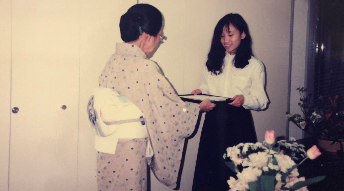 Receiving the certificate of a Japanese flower arrangement course during her exchange year in Tokyo <em>(courtesy of interviewee)</em>