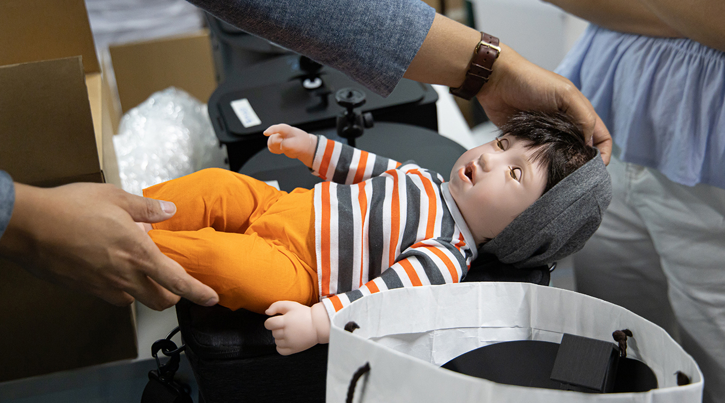 Zunosaki’s rehabilitation baby doll for Asians. The doll may blink and react in different ways when cuddled or patted, helping dementia patients relearn emotions and interact with others