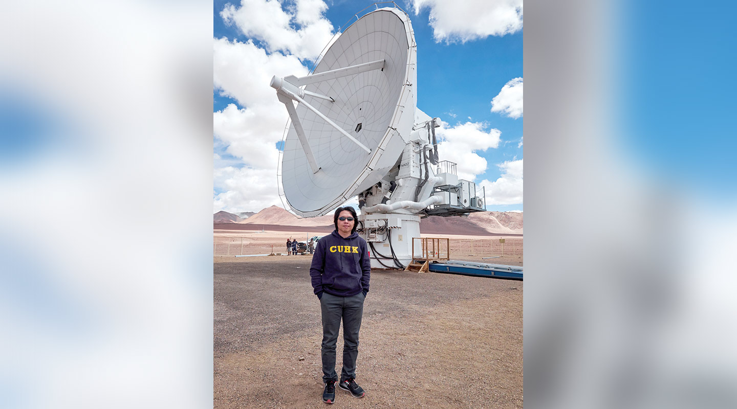 Professor Li in front of the Atacama Submillimeter Telescope in Chile