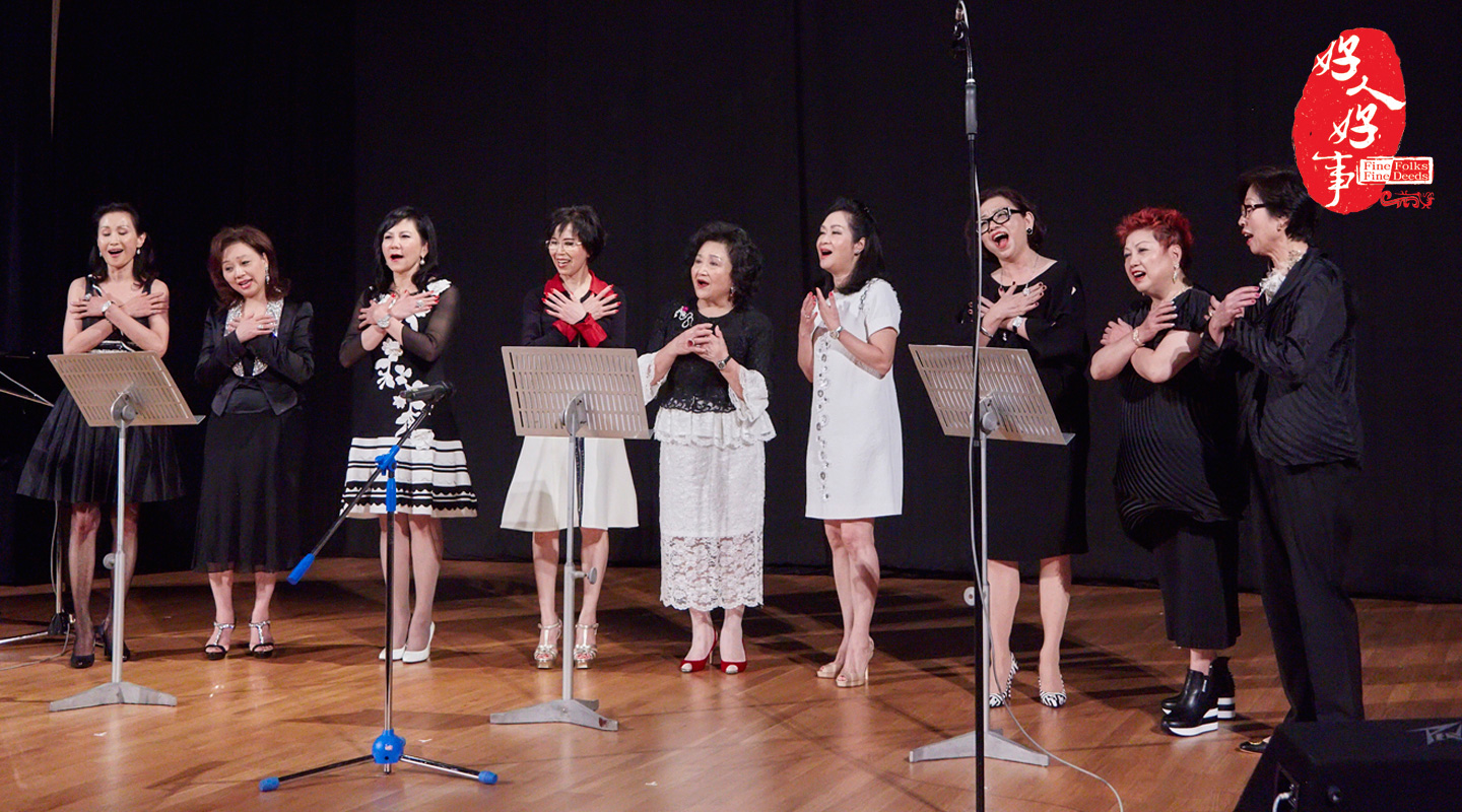 Mrs. Chung (<em>4th left)</em> and her Bible study group singing devotedly at the <em>Music Picnic</em> concert