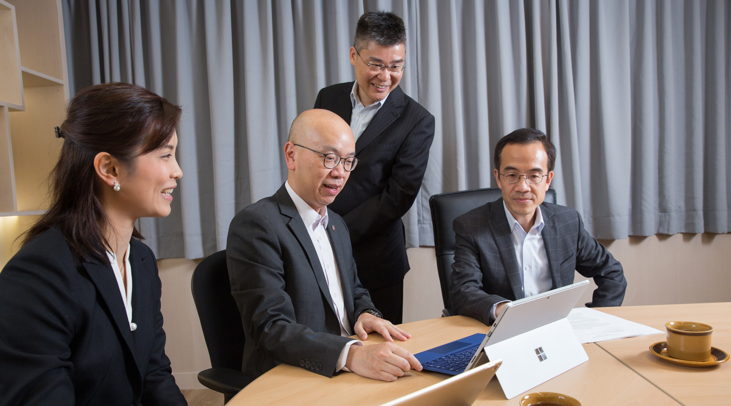 The UHS management team: (from right) Prof. Dennis Ng, Pro-Vice-Chancellor; Dr. Michael Tong, Dental Surgeon In-charge; Dr. Scotty Luk, Director; and Dr. Gloria So, Assistant Director <em>(Photos by Keith Hiro)</em>