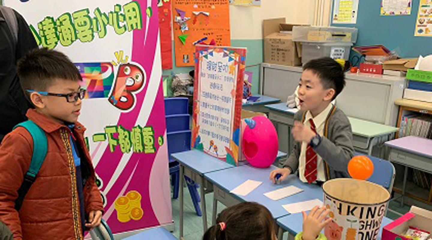 Setting up booth for financial literacy <em>(courtesy of interviewee)</em>