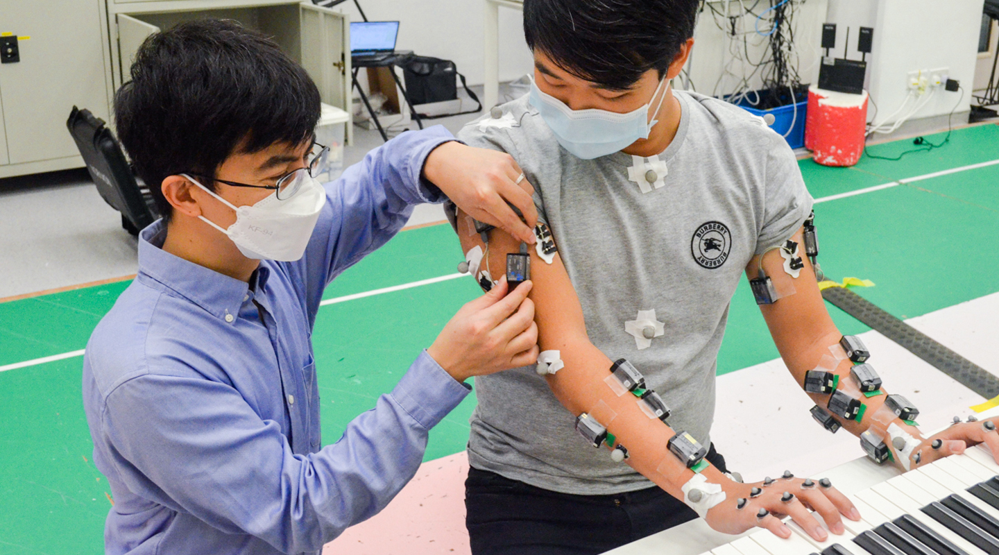 Attaching sensors to the human body to study how we learn a difficult hand task such as playing the piano <em>(Photo courtesy of the interviewee)</em>
