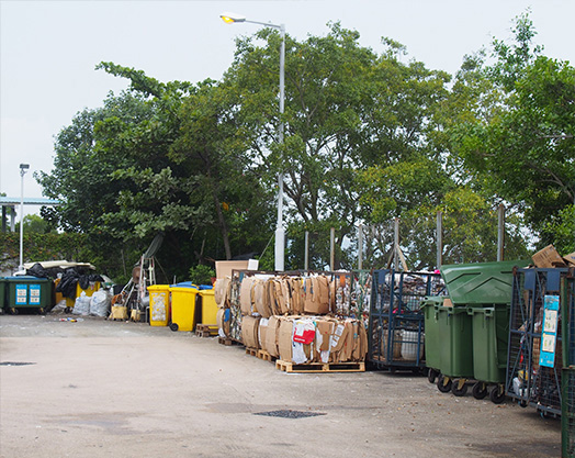 <em>Refuse collection centre of CUHK: with QR codes and RFID tags, trash bags and trash bins collected here can be traced back to their offices of origin</em>